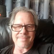 How do stage lighting professionals trigger scenes?