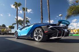 Black And Blue Lamborghini Centenario Lamborghini Centenario Roadster Painted In Blu Cepheus Blu Hera W Bianco Accents And Exposed Carbon Fiber Pho Lamborghini Centenario Lamborghini Super Cars