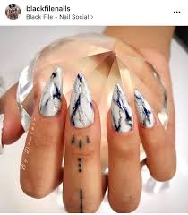 Acrylic Black And White Marble Nails White And Black Marble Stiletto Acrylic Nails With A Blue And Silver Glitter Accent Black Marble Nails Nails Stiletto Nails