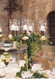 Lovely Candelabra And Greenery Wedding Centerpieces Wedding Tablescapes Wedding Decorations