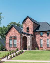 Traditional Style Red Brick Home With Black Roofing And Sandy Stone Accents Red Brick House Exterior Brick Exterior House Red Brick House