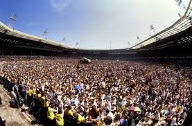 Completed in 2007, it was built on the site of the original stadium which dated back to 1923 and that with its 'twin towers' was perhaps the most famous in the world. Live Aid In Photos July 13 1985 Flashbak Concert Crowd Wembley Live Aid