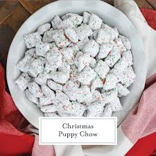 The shape of the pieces coated in chocolate resembles dog food. Christmas Puppy Chow Recipe