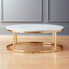 This versatile furniture boasts a round top with a fixed bottom shelf for books or magazines. Smart Round Marble Brass Coffee Table Reviews Cb2