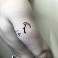 Due to its association with death, the grim reaper is commonly seen as a symbol for negativity, which is a misconception. Small Black Scythe Tattoo On The Right Bicep Tattoos Semicolon Wrist Tattoo Cool Arm Tattoos