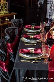 Take a chic stance on halloween especially if you already have the swank loft or penthouse. Elegant Black Red And Gold Halloween Table Setting Entertaining Diva From House To Home