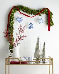 Decorate your mantle with greenery, then add ribbons and ornaments for a pop of color. 12 Christmas Decorating Ideas