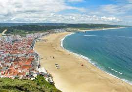 The town is situated on a wide bay of golden sands and stands in the shadow of the towering sítio headland. Nazare Portugal Tourism Guide Updated For 2021