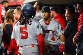 Lile, Nationals roar back to hold off Reds in 10 innings