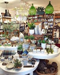 1000 Ideas About White Round Tables On Pinterest Round Kitchen Tables Round Dining Room Tables And Ki Gift Shop Displays Store Decor Garden Center Displays
