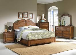 Inspiration for a large mediterranean master medium tone wood floor, vaulted ceiling and wood wall bedroom remodel with white walls, a standard fireplace and a tile fireplace. Kajaria Wall Tiles Master Bedroom Flooring Ideas Design Best For Bedrooms Atmosphere Vitrified Vertified Catlogs Tile Glass White Small Bathroom Floor Marbals Catalog Apppie Org