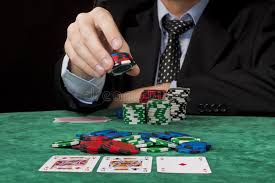 Placing A Bet A Businessman Placing A Bet In A Texas Hold Em Poker Game Sponsored Businessman Placing Placing Poker Online Poker Gambling Machines