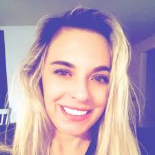 Charisse holding our new T-shirt (ladies cut