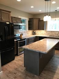 Maybe you would like to learn more about one of these? Wellborn Cabinet Inc Essex Maple Drift Cabinets With Wilsonart Autumn Carnival Backsplash With Dark Cabinets Beige Backsplash Marble Countertops Dark Cabinets