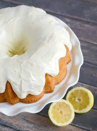 With long serrated knife, split each cake layer in half horizontally. Lemon Bundt Cake With Cream Cheese Frosting Creations By Kara
