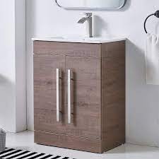 The ceramic surface accommodates the included rectangular sink in a crisp white finish. 24 Inch Small Bathroom Vanity Sink Combo In Brown Wood Grain Mdf Bath Vanity With Sink Modern Bathroom Vanity Cabinet With 2 Door And Ceramic Sink Single Bathroom Vanity Set Kitchen Bath Fixtures Bathroom