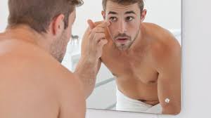 looking handsome in the mirror