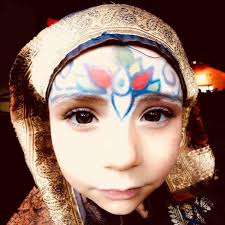 Julia and Ingrid practicing acro yoga in the light of the midnight sun.