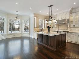 Warmer whites have a slight beige undertone to them and work well on cabinets that may have a tumbled travertine backsplash or to coordinate with wall colors that are warmer. Kitchen Cabinets Dark Floorsantiqued Kitchen Cabinets On Pinterest Antique White Kitchen Antique White Kitchen Cabinets Home Kitchens