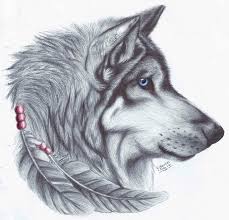 Wolf tattoos continue to be one of the most popular tattoo ideas for men. Native Blue Eyed Wolf Portrait In Profile With Feathers Tattoo Design Tattooimages Biz