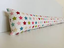 Now you have a fully functional draught excluder, you may wish to add some decorative touches. Draught Excluder Filled Pink Colourful Stars Cotton Eco Friendly Save Energy Draught Doors Windows Wheat Hollow Fibre Sausage Snake Save Energy House Warming Gifts Draught Excluder