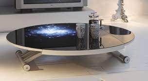 A coffee table is usually a place for temporary storage mostly of newspapers, magazines, books and papers, ending up as a real storage space and a small time capsule of different publications. Clever Coffee Table From Ozzio Space Saving Tables