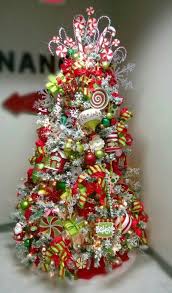 Lime green christmas decorations really stick within the basic red and green color palette. My Tree At The Office Red Lime Green White Candy Flocked Tree Candy Cane Snowfla Whimsical Christmas Trees Christmas Tree Themes Holiday Christmas Tree