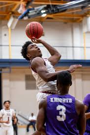 Josh Reid's last-minute layup gives Village dramatic win over Trinity