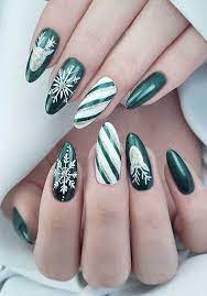 The bright green color combined with the almond shape makes these nails look like tiny christmas trees. Christmas Nail Art Designs To Look Trendy This Season