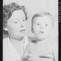 A black and white photo of a woman and a child. Great Depression FFSA