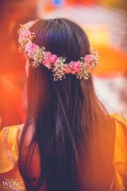 Here you may find decisions for your celebrations, flower bouquets, arrangements and centerpieces, even bulk wedding flowers to buy online. A Bride To Be Flaunting A Floral Tiara On Her Mehndi Floral Tiara Online Wedding Planning Indian Wedding Planning