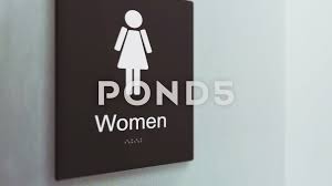 Womens Restroom Bathroom Sign Cu In An Ambient Corporate Office Hal Stock Footage Sign Cu Bathroom Womens Bathroom Signs Bathroom Signage Ladies Restroom Sign