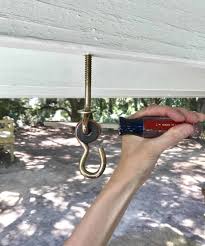 To learn how to make your porch swing more comfortable by installing comfort springs, scroll down! How To Hang A Porch Swing With A Swing Makeover