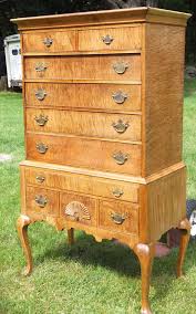 Three drawers over one larger drawer and three smaller graduated drawers (all dovetailed), tiger maple drawer fronts, stiles, and bases of columns. Furniture Repairs Restoration