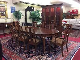 A vintage set of 4 dining chairs by pennsylvania house offer cherry construction in queen anne styling with backs having shaped rail and stylized urn slat backs over upholstered seats raised on cabriole legs with pad feet, signed beneath as photographed, 20th century. Pennsylvania House Table And Chairs