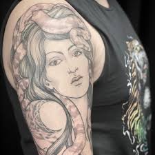 Triple Goddess Tattoos added a...