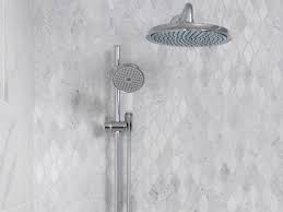 Bring the same bold style to your bathroom by creating a single statement wall with patterned tiles in a neutral hue. 40 Free Shower Tile Ideas Tips For Choosing Tile Why Tile