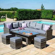 Lined with woven wicker and founded on a sturdy iron frame, this outdoor dining table strikes a curvaceous silhouette with a rectangular tabletop, bowed. Garden Sofa Set With Rising Table Off 60