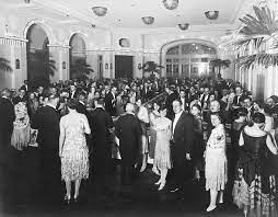 Complete your roaring twenties ensemble with a feathery fan. A Grand Dinner Party Photograph By Underwood Archives