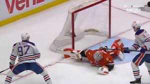 Dostal robs McDavid with the pad