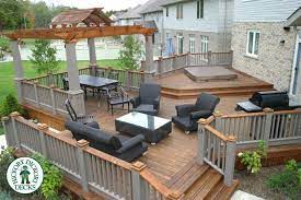 This Is A Very Unique Deck Built By Our Franchise In Kitchener Waterloo The Decking Is Ipe And The Railing Is Stained C Deck With Pergola Patio Decks Backyard
