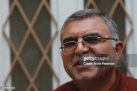 Children of the family of Suad Mohammed play with new chicks outside...  News Photo