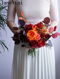Wedding table decorated with gorgeous flower bouquets and candles in vintage candlesticks. Janevini Vintage Autumn Winter Wedding Flowers Bridal Bouquets 2020 Imitation Flower Red Orange Rose Leaves Bride Brooch Bouquet Wedding Bouquets Aliexpress
