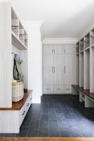 Modern Farmhouse Inspiration An Expansive Gray Mudroom Boasts Slate Floor Tiles And Gray Oak Flat Front Cabin Mudroom Flooring Slate Flooring Slate Tile Floor