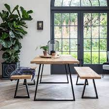 The graceful curved legs and cast brass mounts. Armstrong Industrial Dining Table Solid Wood Black Metal Legs