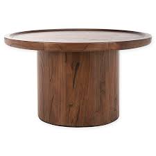 Safavieh Devin Round Wooden Coffee Table Bed Bath Beyond In 2020 Round Wooden Coffee Table Pedestal Coffee Table Wooden Coffee Table