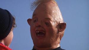 He is seen with only a couple of teeth, and his eyes are slanted. The Heartbreaking Tale Of The Actor Who Played Sloth In The Goonies