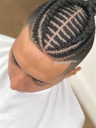 Intricate Design Braided Hairstyles For Men Man With Black Hair White T Shirt In 2020 Cool Braid Hairstyles Braided Man Bun Mexican Hairstyles