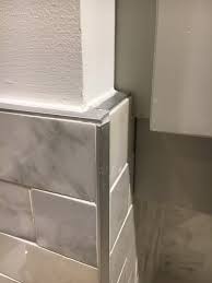 At this point, you may need to cut some tiles with a tile saw or a tile cutter to fit around outlets or switch boxes. Terrible Tile Edging Joints On Backsplash