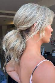 The pony follows the undone style of the hair. High And Low Ponytails For Any Occasion Ponytail For Medium Hair Length